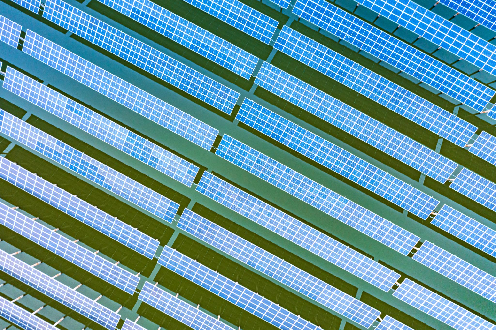 Aerial view of solar panels — renewable energy for supermarket operations